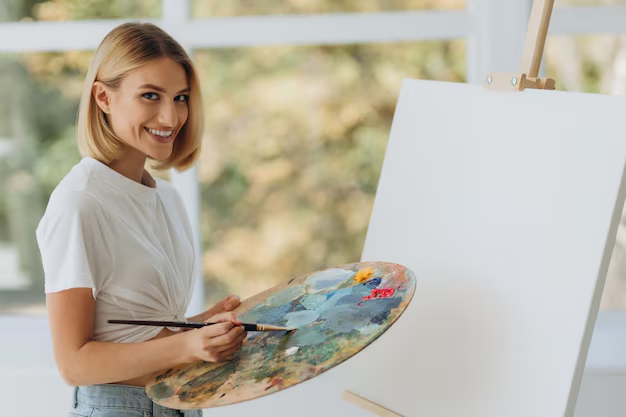 Person painting with watercolours in an art therapy session.